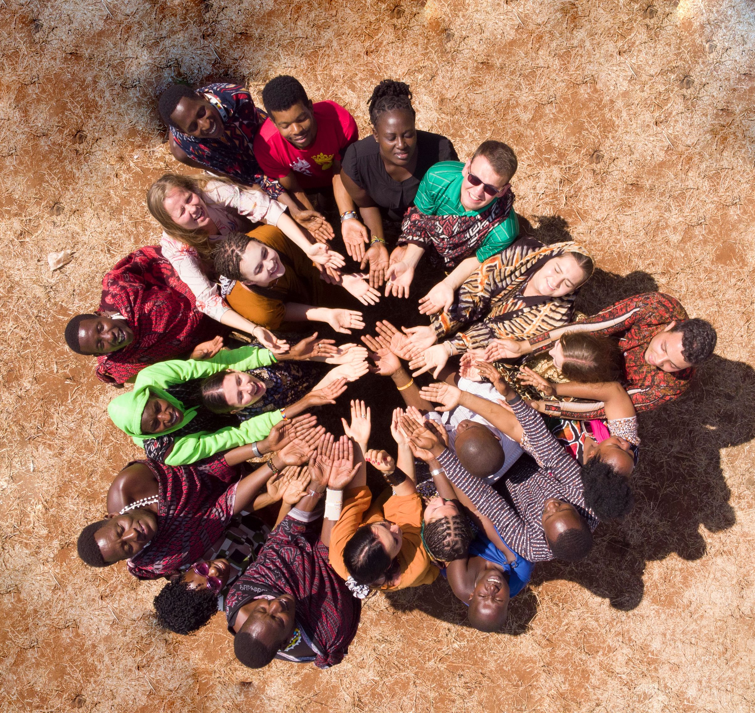 Community members gathered together in a circle