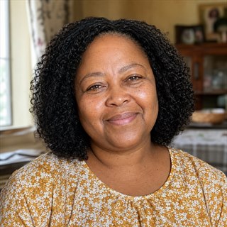 Zanele Dube in her home